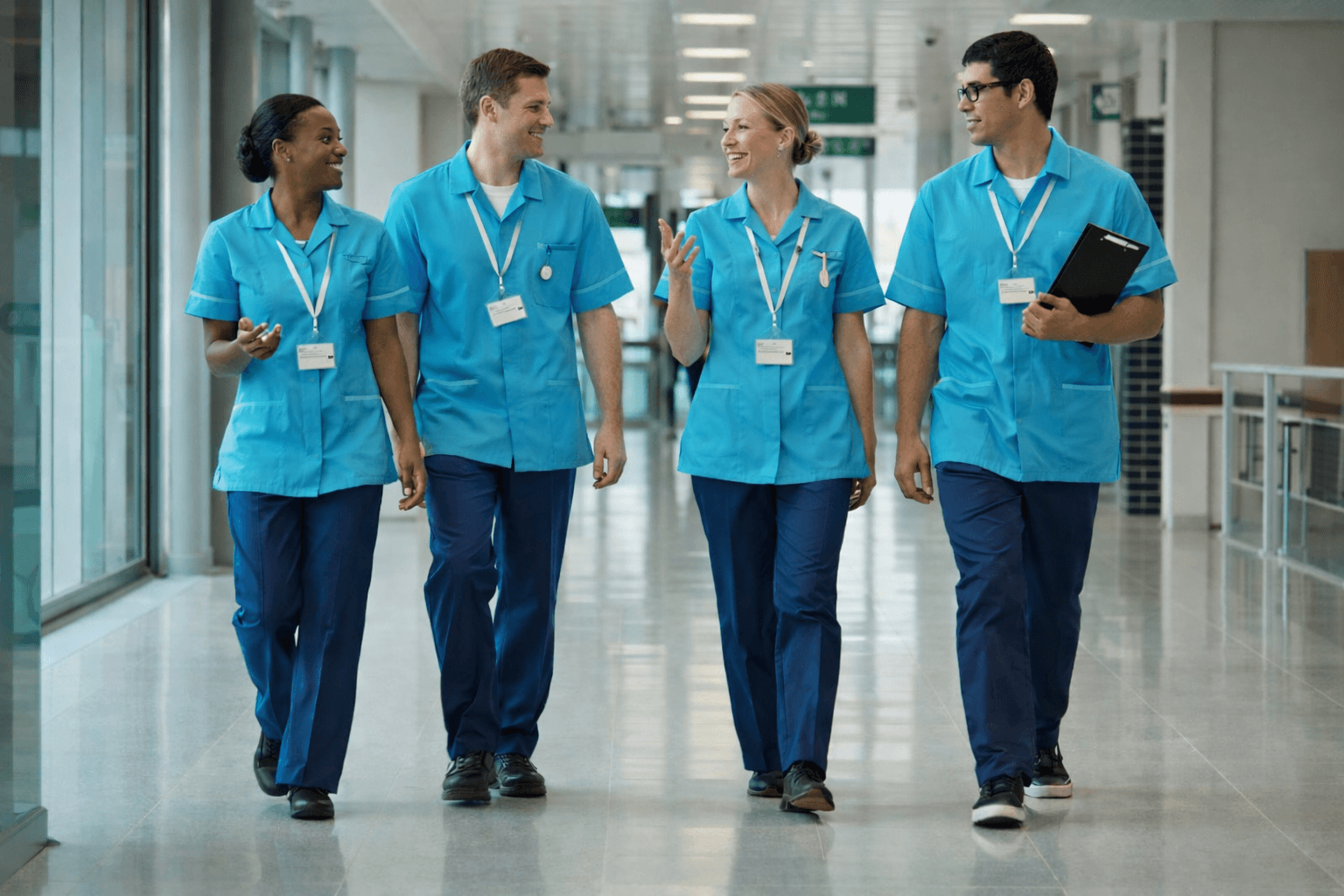 Group of healthcare professionals in blue scrubs at Xfini Academy, Ireland